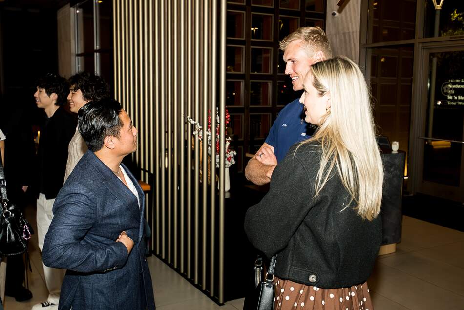 Guests talking between talks